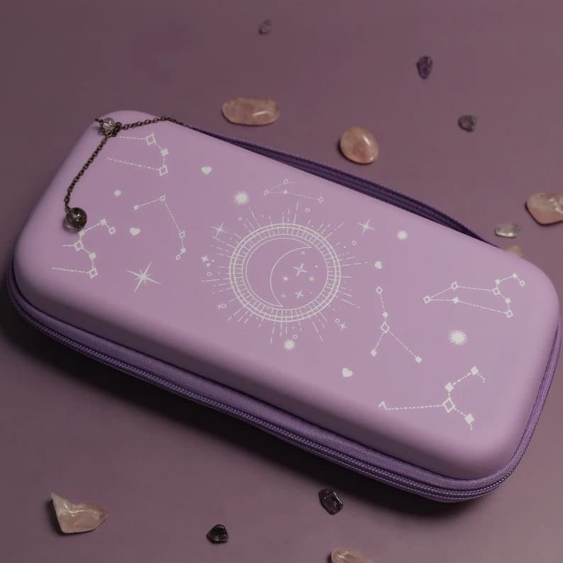 Lavender Nintendo Switch Cosmic Moon carrying case with white celestial moon and constellation design