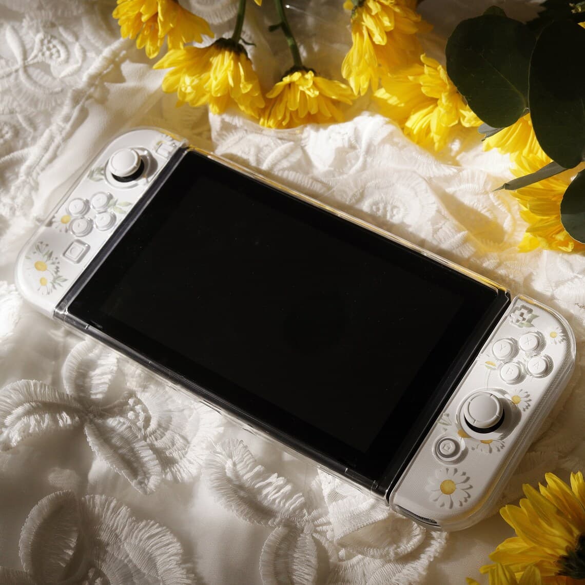 Front view of Nintendo Switch with clear Daisy Daydream case attached to Joy-Con covers, showing screen and floral pattern