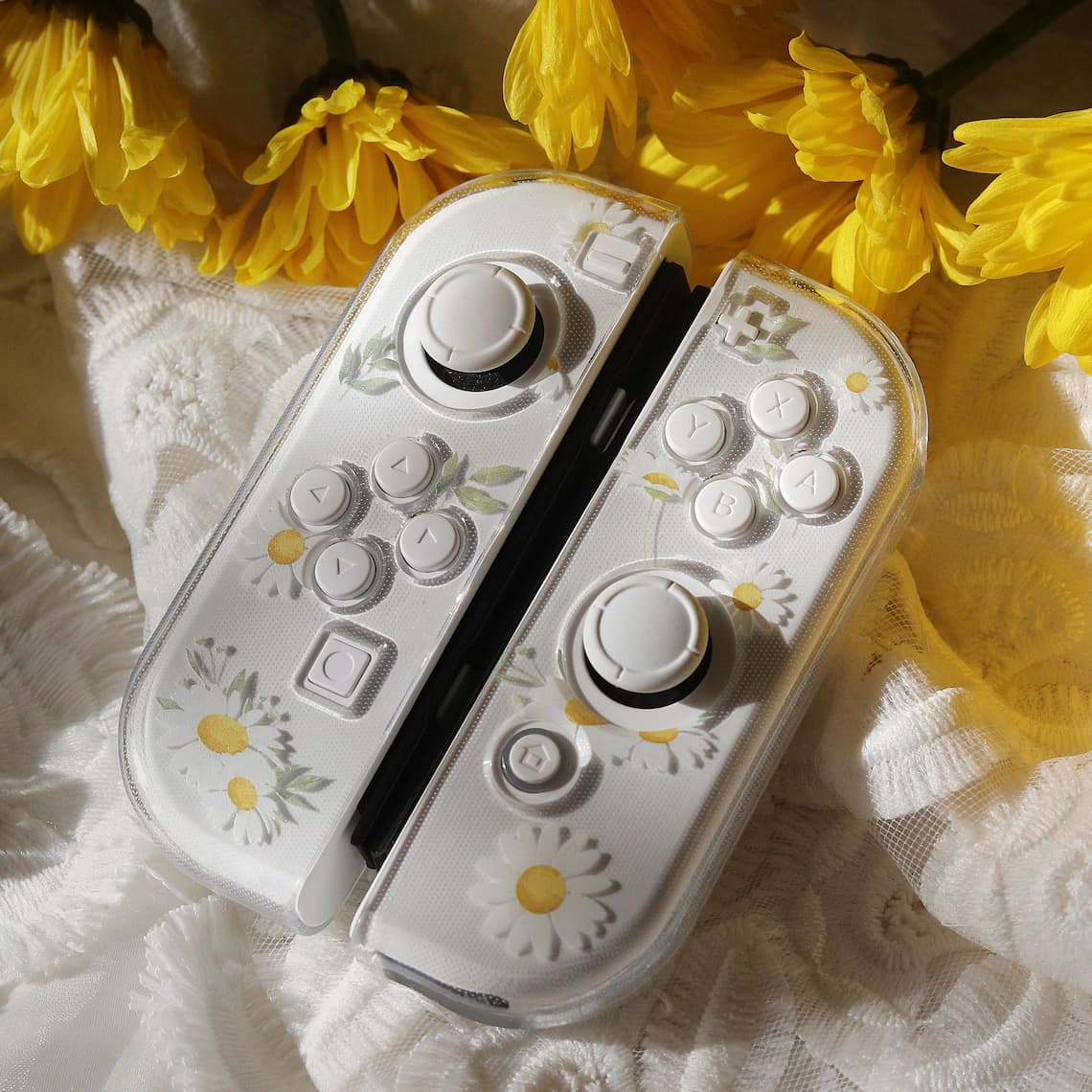 Close-up of clear Nintendo Switch Daisy Daydream Joy-Con covers showing watercolour daisy floral detail